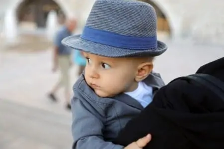 Cute Italian baby boy wearing an Italian hat and suit