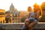 Italian girl and mother overlooking Italian city