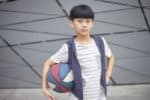 Chinese boy holding a basketball