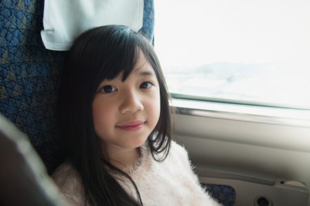 Korean girl sitting on the train