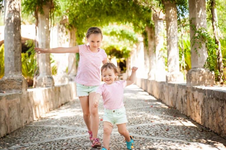 Two portuguese girls playing in the garden