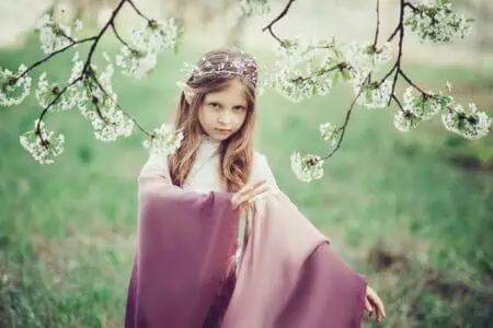 Mystical elf little girl in spring garden